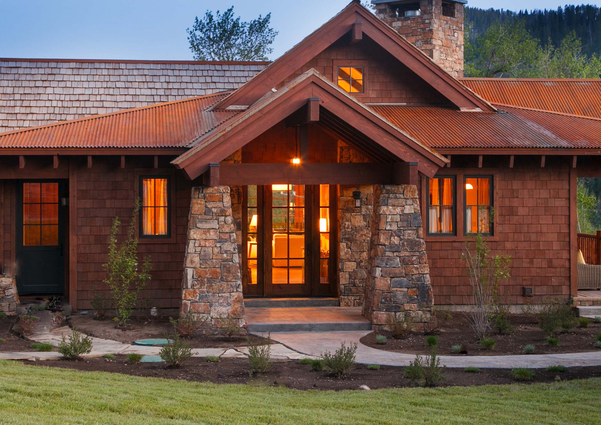 The charming Tall Timber Cottage glows; represented by Obsidian Real Estate with interiors designed by WRJ Design.
