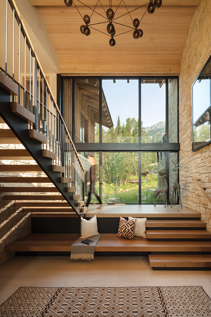 The floating stairs were crafted in Bozeman, Montana, and match the pristine white oak flooring that is featured throughout the home.