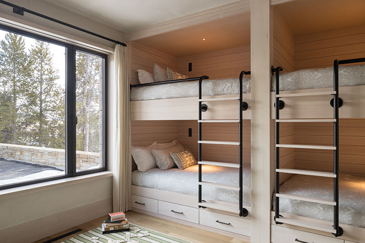A bunkroom built for full comfort means queen sized beds, recessed lighting, and views that bring nature’s sense of peace into the space. Although meant for communal living, the nested feel would give any guest a sense of privacy.