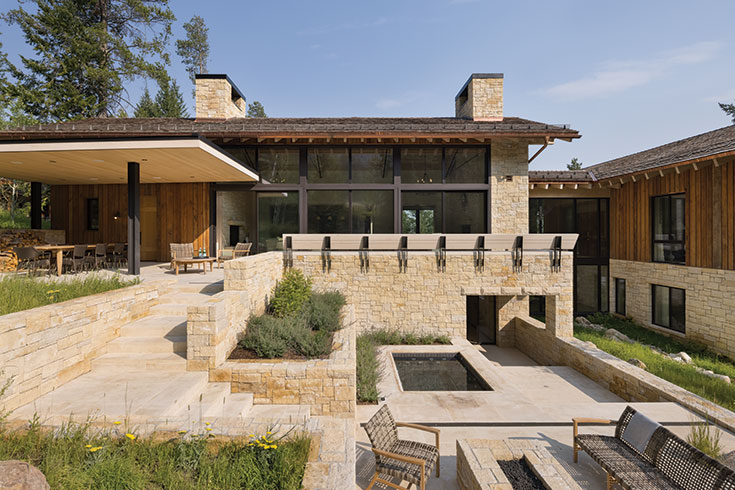 When approaching the site, the windows and roofline compel the viewer to take a closer look. But the elevated green space featuring tall grasses anchor the eye, exuding lush movement against the clean lines of this mountain modern home.