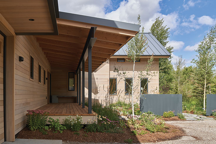 Thoughtful, native landscaping and an expanded, Western-style porch create an ambiance of welcome and timelessness eased into the surrounding landscape.