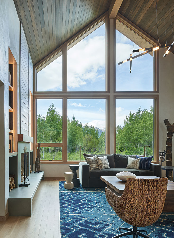 Understated wall and floor materials emphasize both the breathtaking mountain view and the owner’s expansive collection of art.