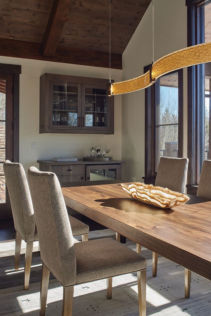 The elegant walnut table and complementary bar—custom designs by WCDG—facilitate the clients’ love for entertaining friends.